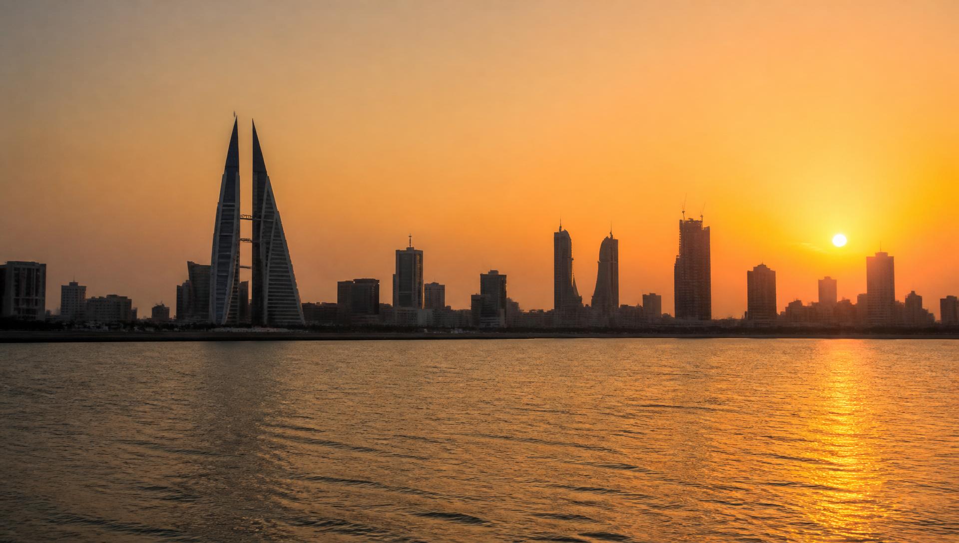 Manama skyline at golden hour, from across the bay